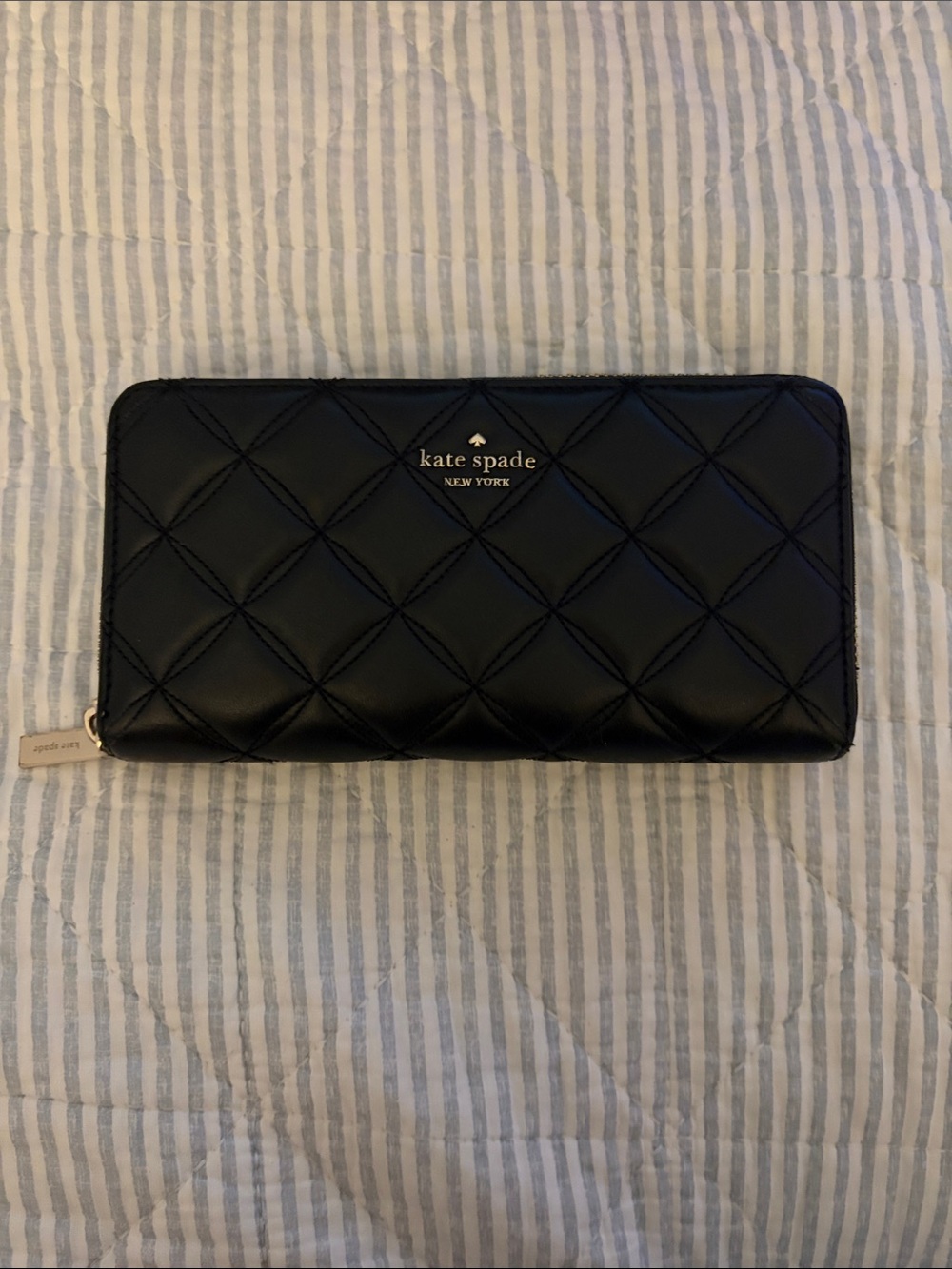 kate spade Black Quilted Zip-Around Wallet with Gold Logo